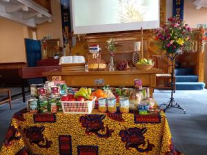 08 Harvest gifts distributed via the Food Bank and fruit and flowers to church members.